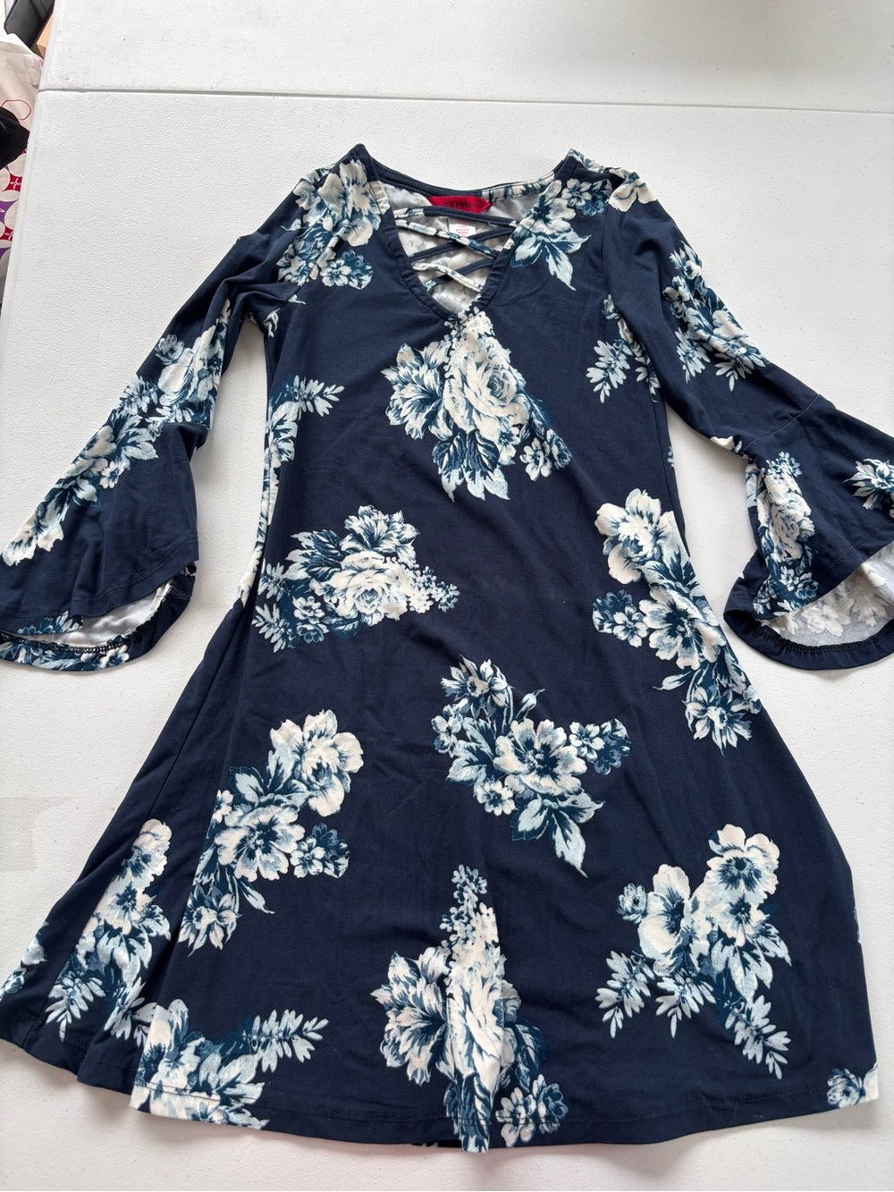1st Kiss Navy and Ivory Floral Crisscross V‑Neck Bell Sleeve Dress